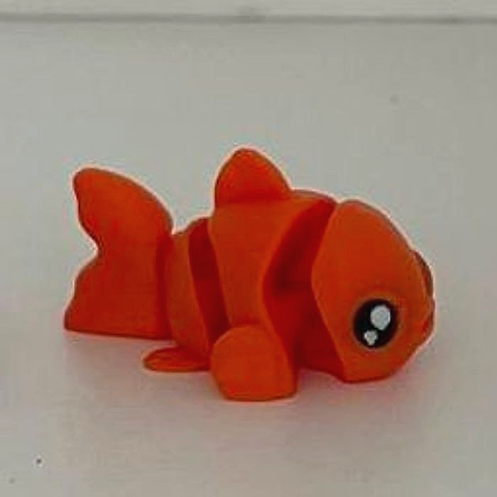A small orange articulated clownfish